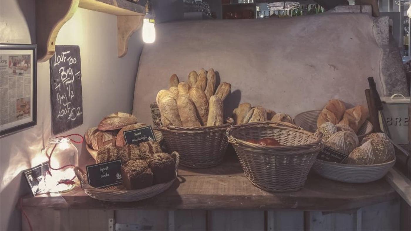 Fresh bread and pastries on a bakery counter