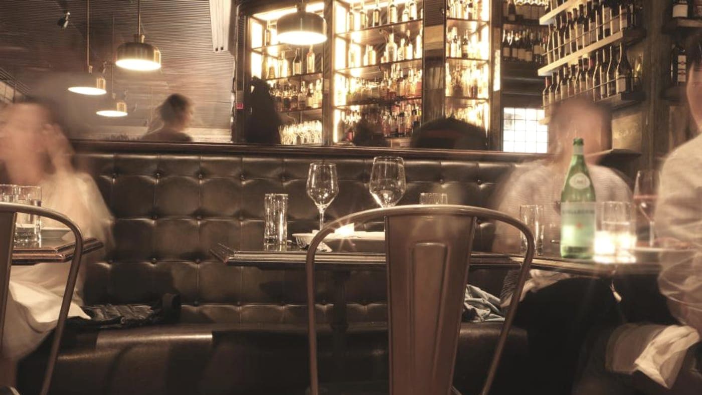 Evening service in a warmly lit tavern dining room
